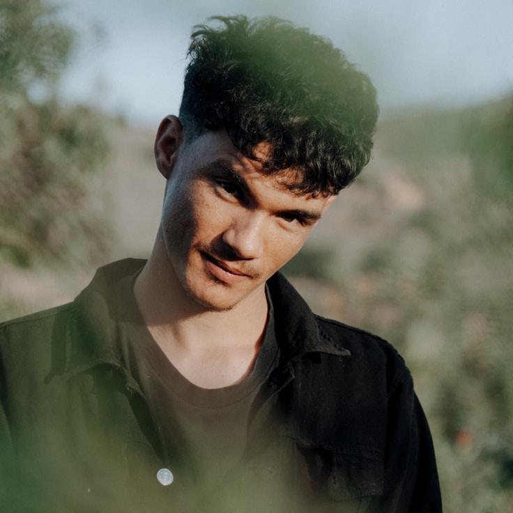 Kaveri Mehta, Lead Design Curator at SpruceMintAtelier, reviewing corporate floral arrangements